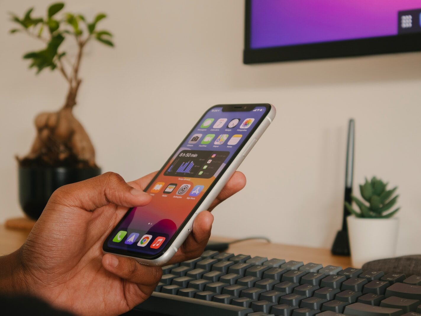 person holding silver iphone 6
